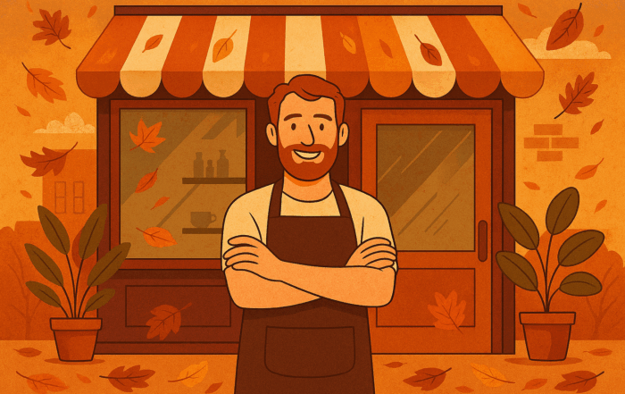 A small business owner stands confidently in front of a storefront with an autumn-themed design, featuring pumpkins, potted plants, and falling leaves.